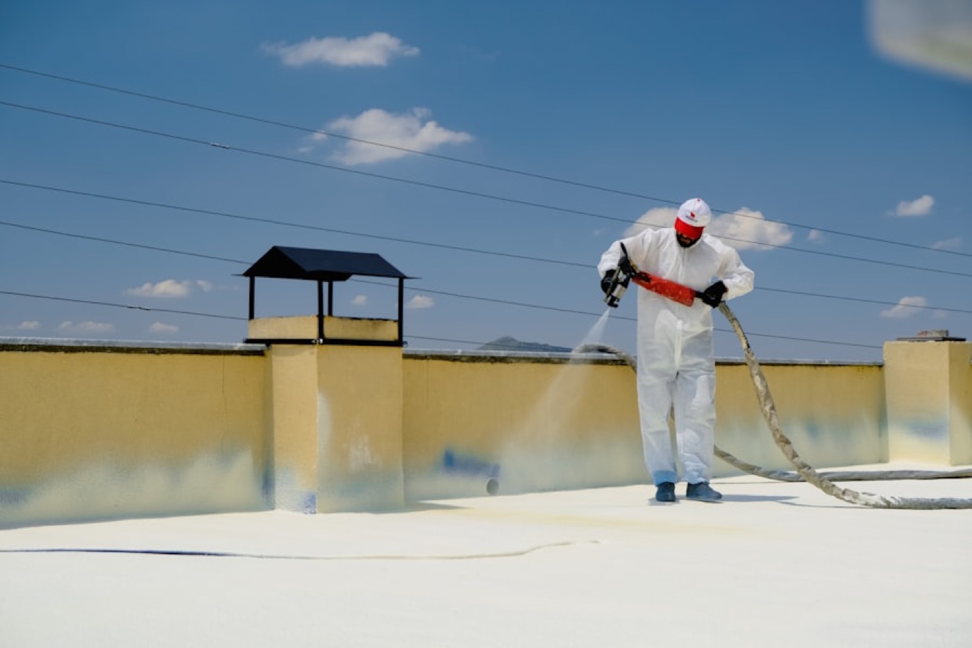 Professional crew applying spray foam insulation