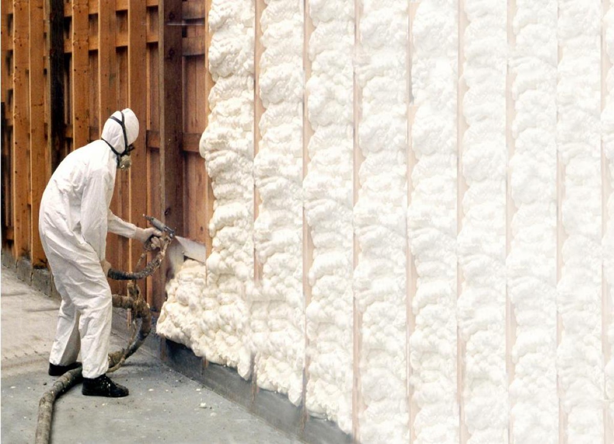 Professional crew applying spray foam insulation